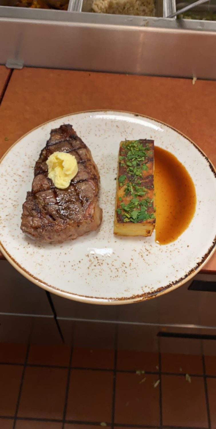 Grilled strip steak, compound butter, pomme pavé